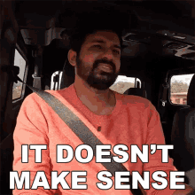 a man in a car with the words it does n't make sense above him