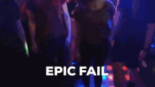 a group of people standing in a dark room with the words epic fail written in white