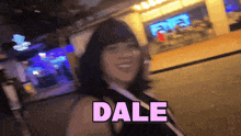 a woman says dale in pink letters on a black background