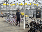 a man stands in front of a greenhouse full of bicycles with the words average josh work day written above him