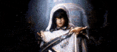 a man in a hooded cape with a mask on his face is standing in a dark room .