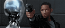 a man in a black leather jacket is pointing a gun at something
