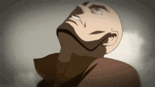 a bald man with a beard is looking up