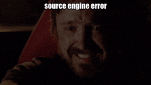 a man with a beard is smiling with the words source engine error above him