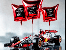 three red balloons with happy father 's day dad on them