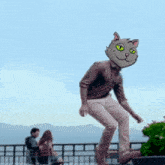 a man with a cat head is sitting on a skateboard