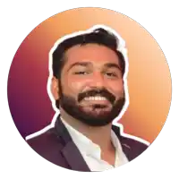 a man with a beard wearing a suit and white shirt