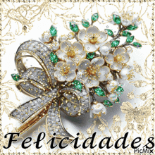 a picture of a brooch with flowers and the word felicidades in the corner
