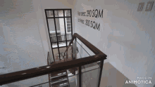 a woman walking down a set of stairs with the words made in animotica on the bottom right