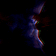 a blurry image of a person 's face with a dark background