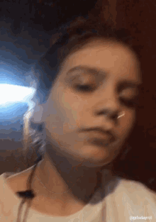 a blurry picture of a woman 's face with the hashtag gifsdayrol at the bottom