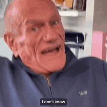an older man wearing a lacoste jacket says i don 't know