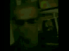 a man wearing sunglasses is standing in front of a car