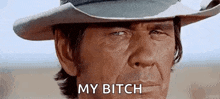 a close up of a man wearing a cowboy hat and saying `` my bitch '' .