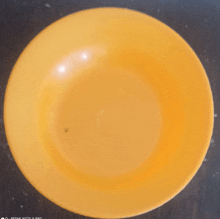 a yellow plate with a redmi note 8 pro written on it