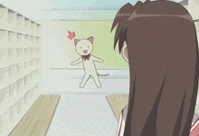 a girl with glasses is standing in front of a cat
