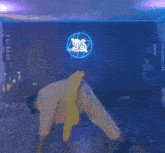 a person is doing a handstand in front of a neon sign that says s & a