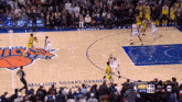 a basketball game is being played on the madison square garden court
