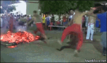 Jumping Fire GIF - Jumping Fire Walking On Fire GIFs