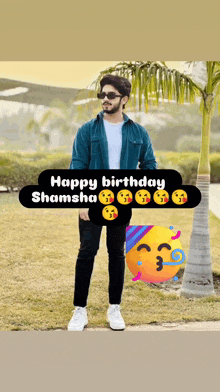 a man is standing in a field with a happy birthday shamsha sticker