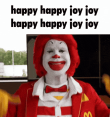 mcdonald 's ronald mcdonald is wearing a red and white striped suit and bow tie and is smiling .
