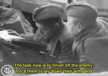 a black and white photo of two soldiers with the words " the task now is to finish off the enemy "