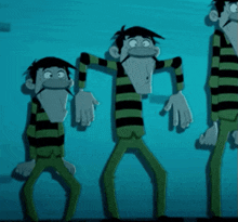 a cartoon character is holding another cartoon character in a green and black striped blanket .