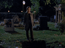 a grave in a cemetery has a heart shaped gravestone
