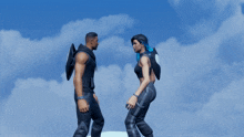 a man and a woman are standing next to each other and the man has a logo on his back