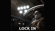 a picture of a man wearing a virtual reality headset with the words lock in above him