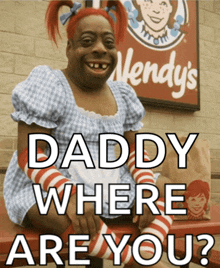 a wendy 's sign is behind a cartoon character