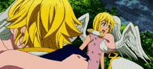 a man and a girl with angel wings are standing next to each other .