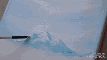 a painting is being painted on a canvas with the words made in animotica on the bottom