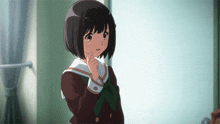 a girl with short black hair and a green bow on her school uniform