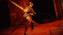 a person in a video game is holding a sword in front of a fireball