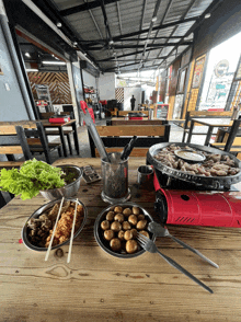 a table with plates of food and a stove that says ' a ' on it