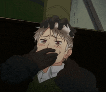 a man with a hand on his head covering his mouth