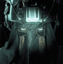 a close up of a person wearing a helmet and a hood