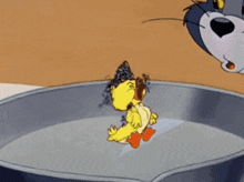 a cartoon of tom and jerry looking at a chicken in a frying pan