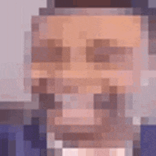 a pixel art of a man 's face with a beard and a hat .