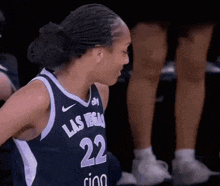 a female basketball player from las vegas wearing number 22
