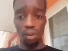 a close up of a man 's face in a blurry photo .