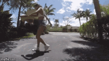 a woman is walking down a street with a imgflip.com watermark