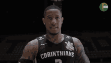 a man wearing a corinthians jersey is standing in front of a basketball hoop