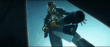 a man in a military uniform is holding a cannon