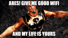 a man with a beard is laying on the ground with a meme that says ares give me good wifi