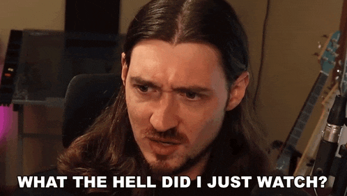 a man with long hair and a beard is asking what the hell did i just watch