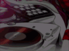 a close up of a dj 's turntable and keyboard