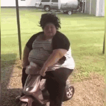 a very fat woman is riding a pink scooter in a park .