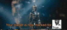 a statue of a man with the words your planet is now marked for true